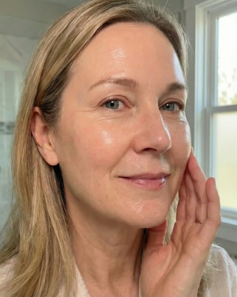 A customer just after peeling the mask off, skin still wet with serum